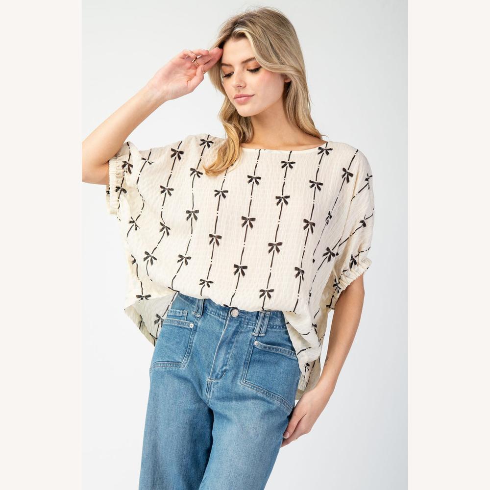 Blouse Femme Beige Texturée avec Nœuds Noirs – Haut Légère en Coton, Manches Élastiquées, Style Décontracté