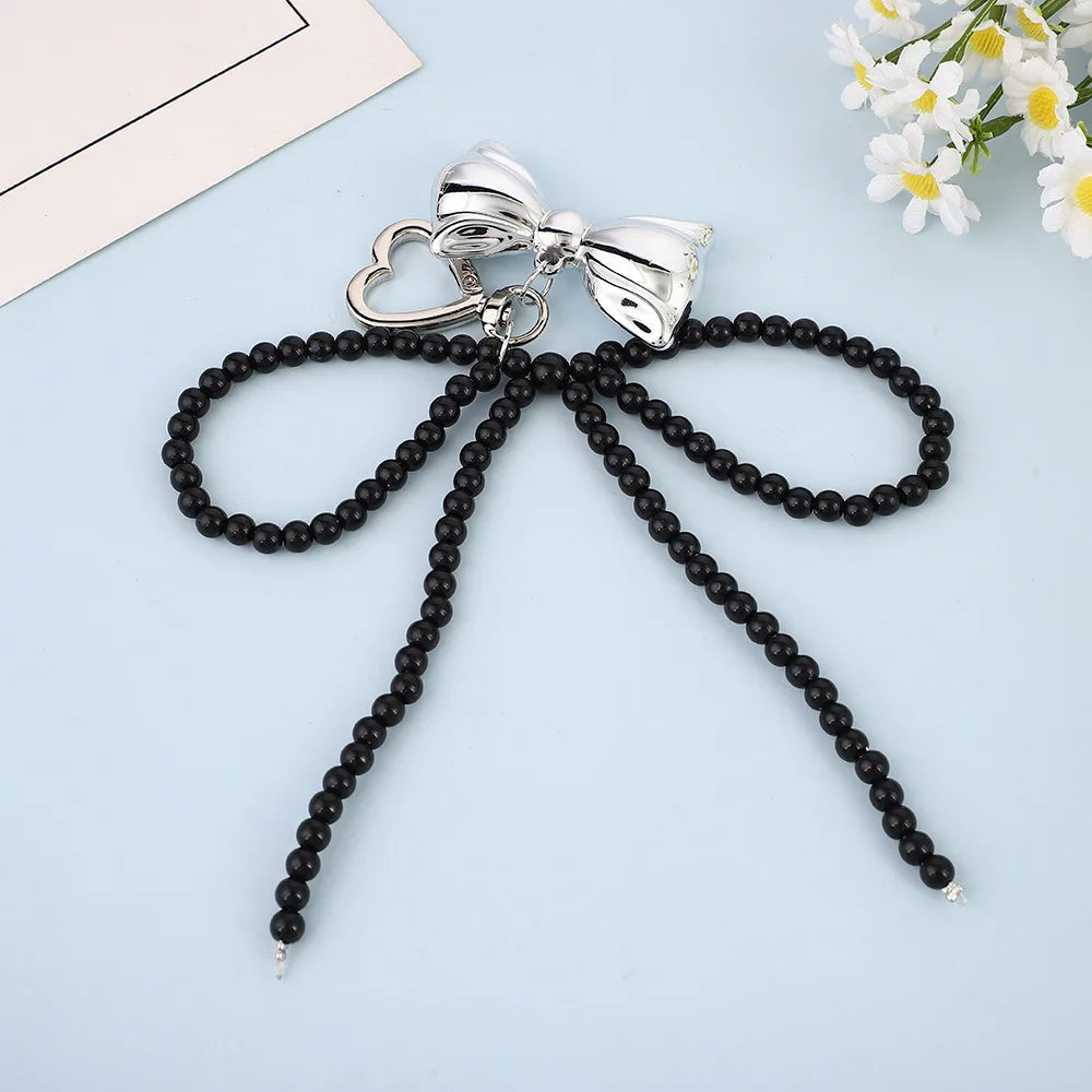 Porte-Clés en Perles avec Nœud en Métal Poli – Accessoire Chic pour Sac à Main et Clés
