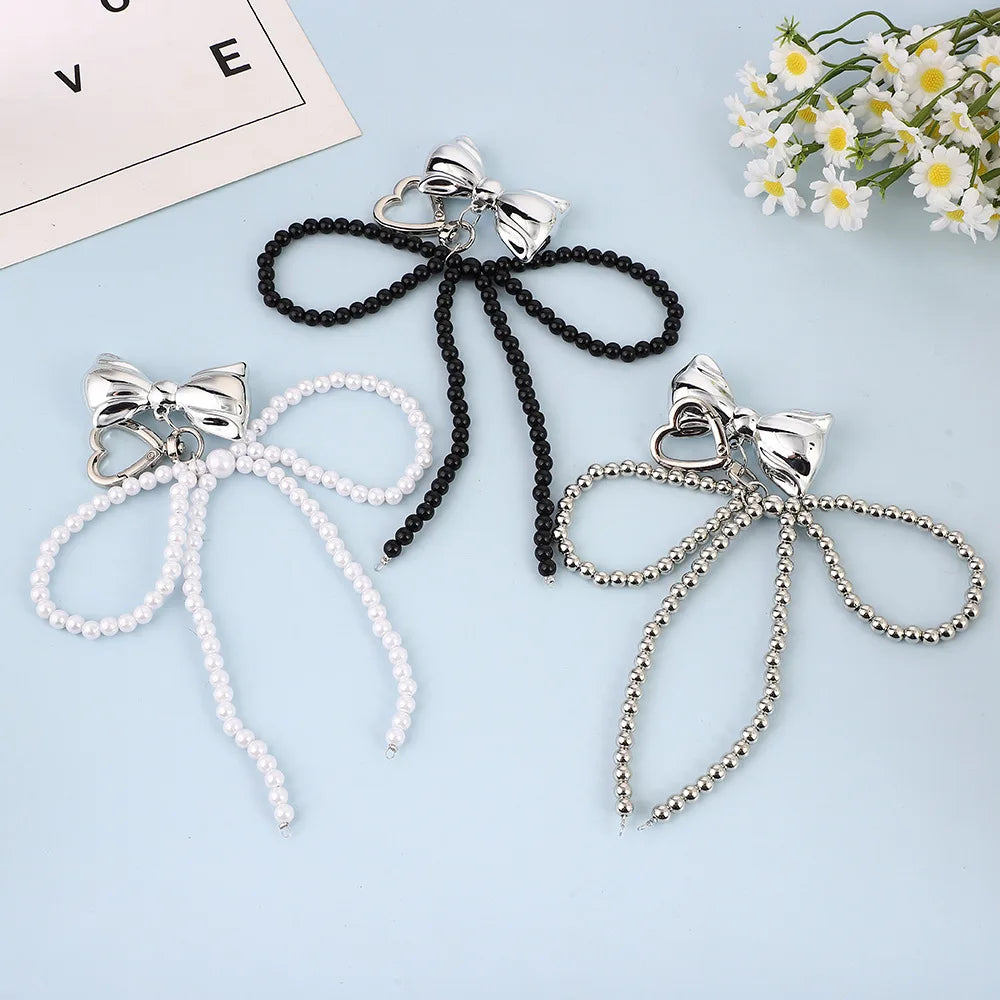 Porte-Clés en Perles avec Nœud en Métal Poli – Accessoire Chic pour Sac à Main et Clés