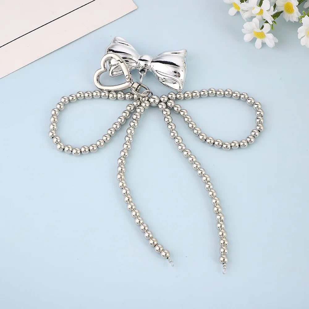 Porte-Clés en Perles avec Nœud en Métal Poli – Accessoire Chic pour Sac à Main et Clés