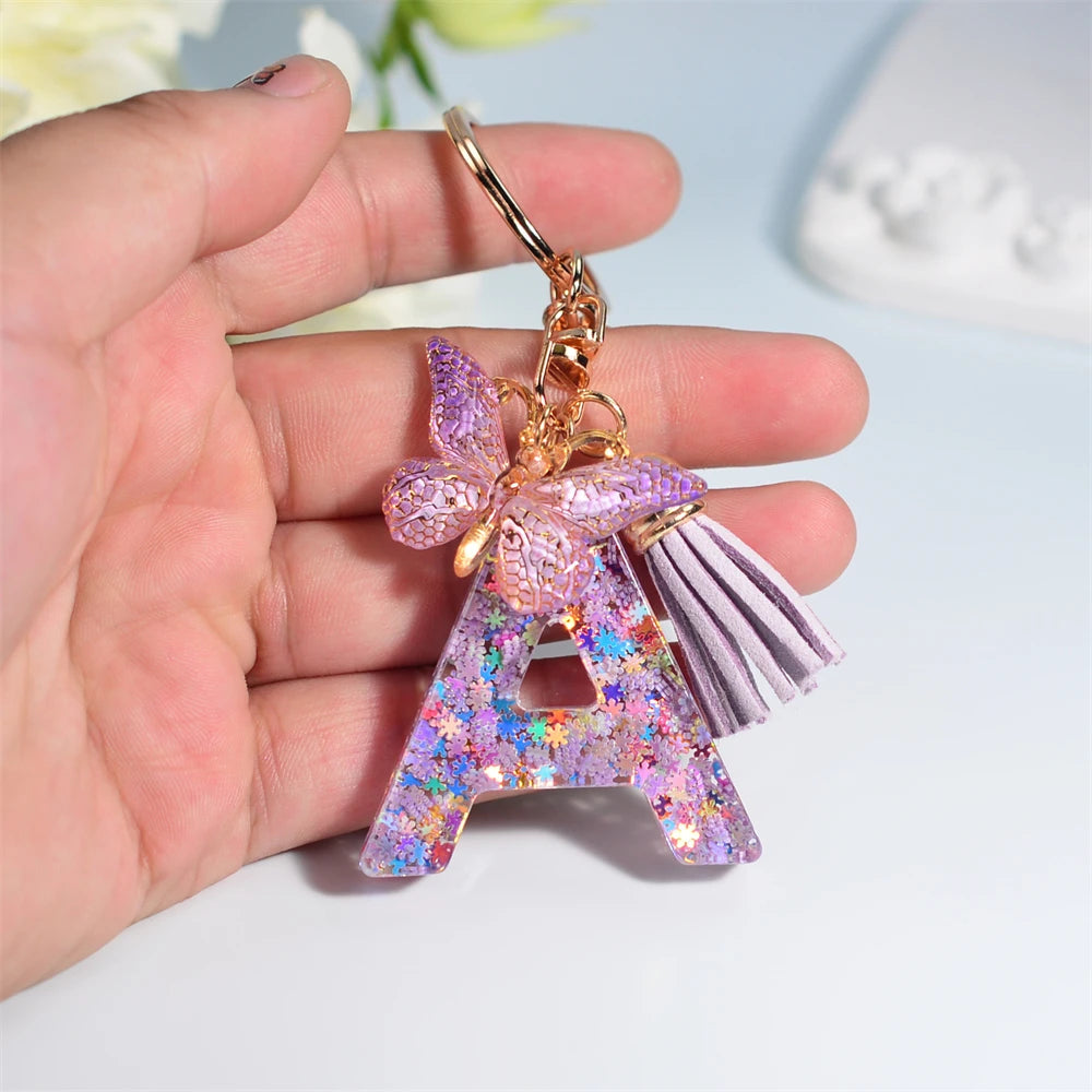 Porte Clés Personnalisé à Paillettes avec Charme Papillon et Gland – Accessoire Coloré pour Clés et Sacs