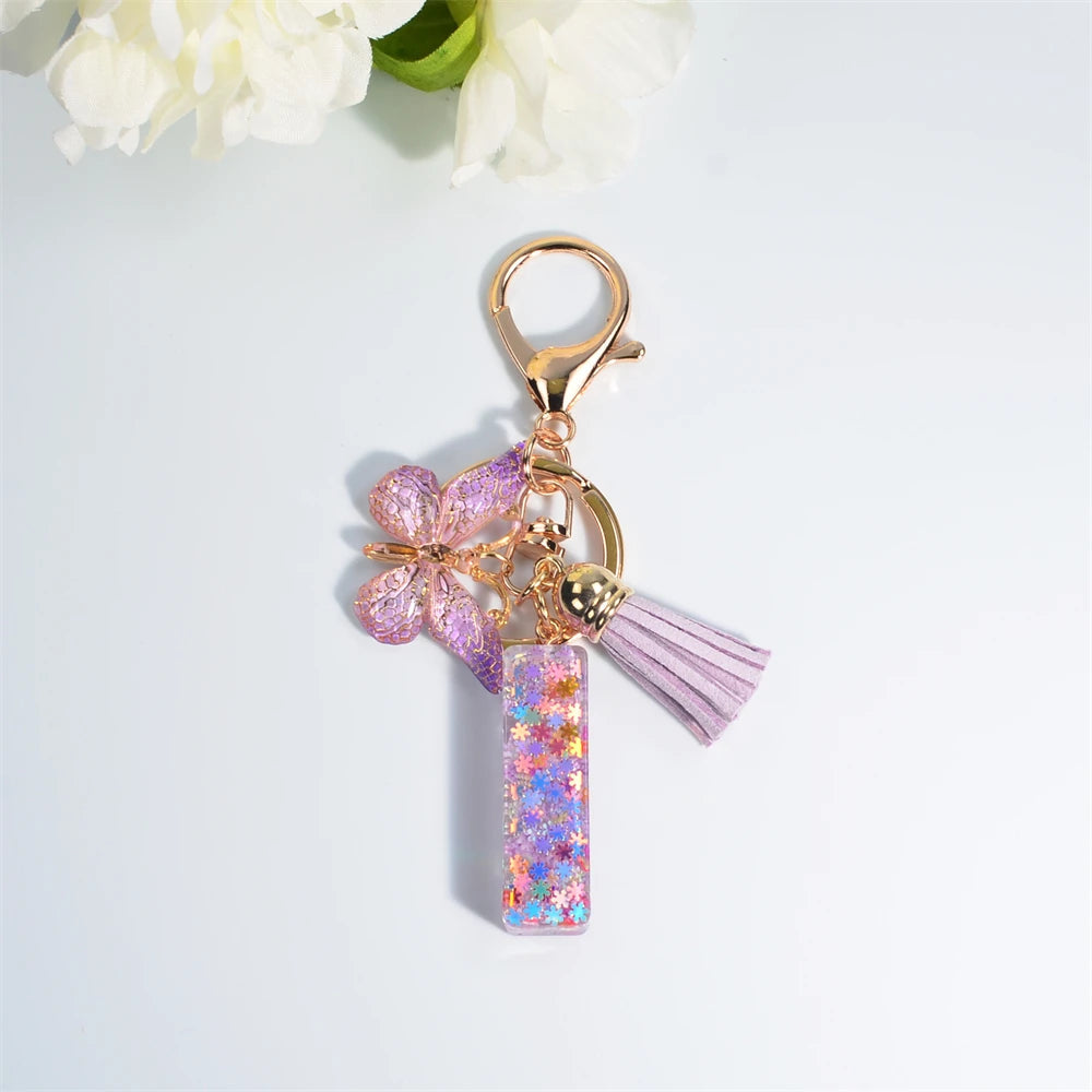 Porte Clés Personnalisé à Paillettes avec Charme Papillon et Gland – Accessoire Coloré pour Clés et Sacs