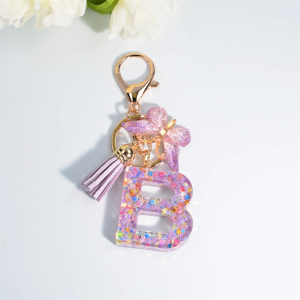 Porte Clés Personnalisé à Paillettes avec Charme Papillon et Gland – Accessoire Coloré pour Clés et Sacs