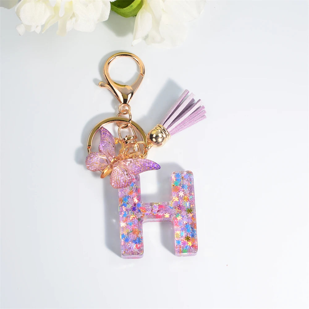 Porte Clés Personnalisé à Paillettes avec Charme Papillon et Gland – Accessoire Coloré pour Clés et Sacs