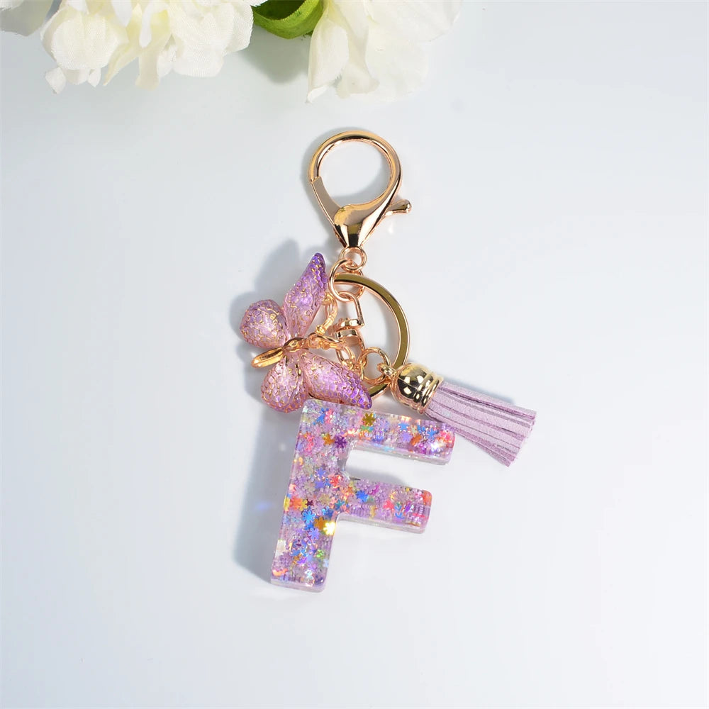 Porte Clés Personnalisé à Paillettes avec Charme Papillon et Gland – Accessoire Coloré pour Clés et Sacs