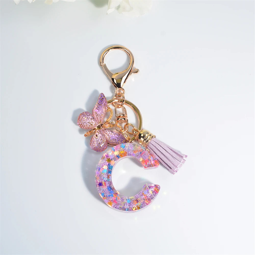 Porte Clés Personnalisé à Paillettes avec Charme Papillon et Gland – Accessoire Coloré pour Clés et Sacs