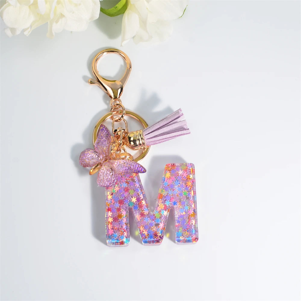Porte Clés Personnalisé à Paillettes avec Charme Papillon et Gland – Accessoire Coloré pour Clés et Sacs