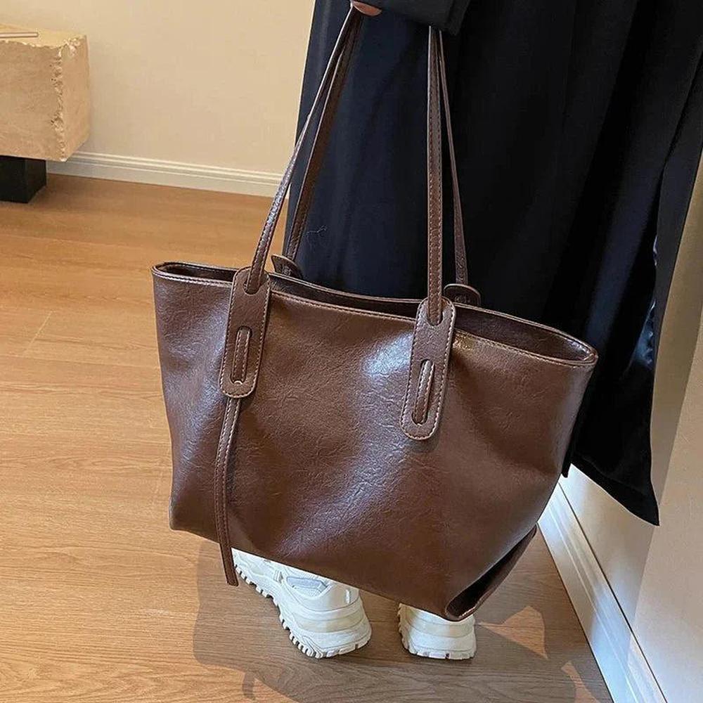 Sac à main femme en cuir noir avec bandoulière ajustable – Élégant et spacieux, modèle Solène