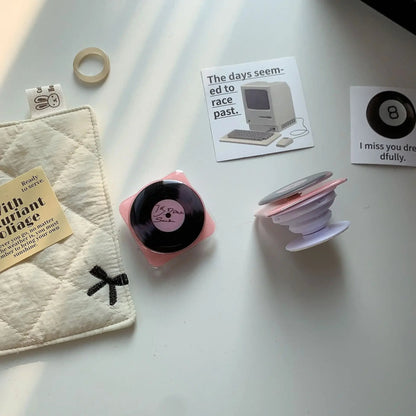 Pink Vinyl Rotating Phone Stand – Elegant Desk Accessory with 360° Rotation and Universal Compatibility