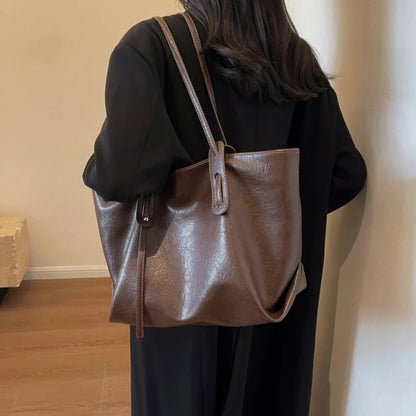 Women's black leather handbag with adjustable shoulder strap – Elegant and spacious, Solene model