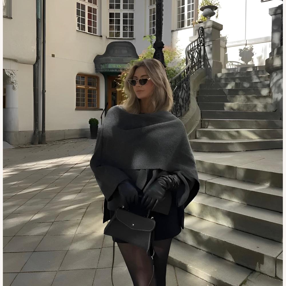 https://cdn.shopify.com/s/files/1/0934/1639/0995/files/elle-luxe-viral-cape-coat-449519.jpg?v=1745366906