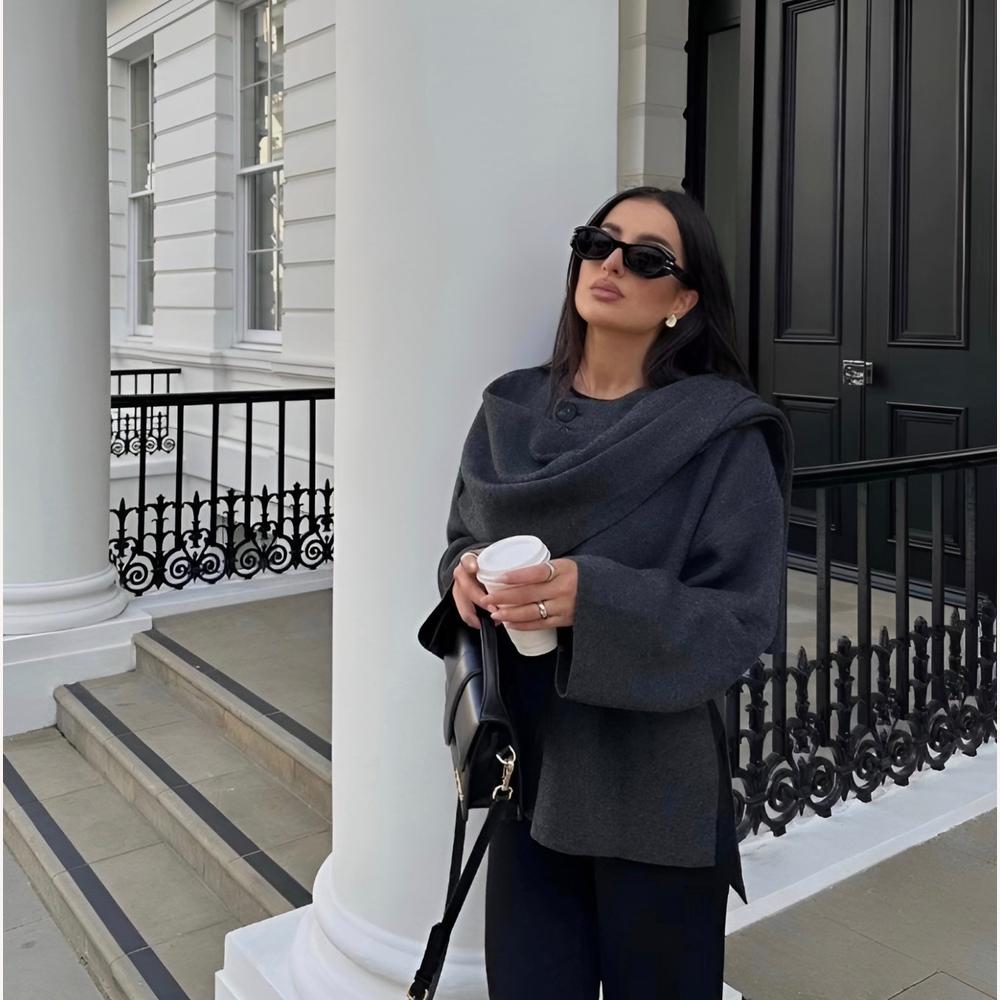 https://cdn.shopify.com/s/files/1/0934/1639/0995/files/elle-luxe-viral-cape-coat-984025.jpg?v=1745366906