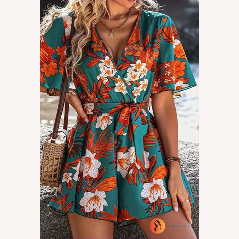 https://cdn.shopify.com/s/files/1/0563/4729/5786/files/lingeriehut-floral-wrap-romper-beach-day-essential-596.webp?v=1723050593